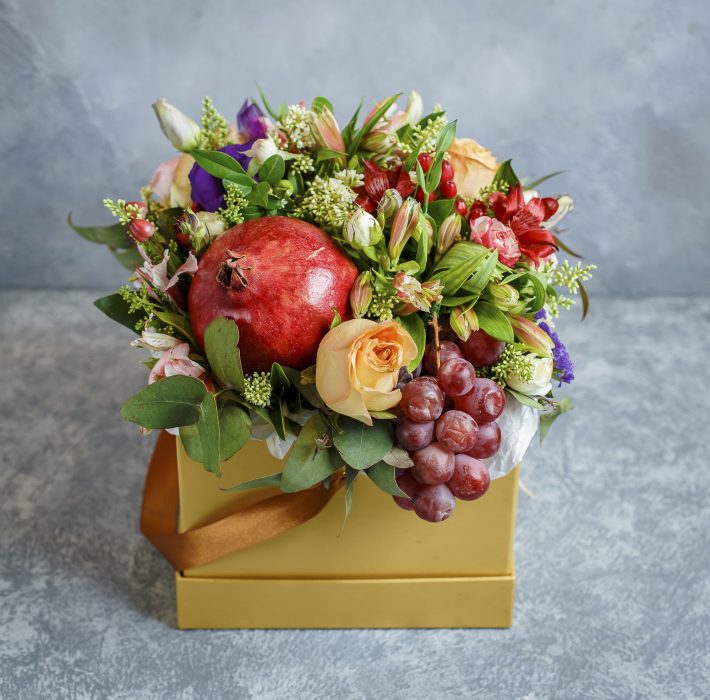 Flower bouquet with pomegranate, grape in yellow square box